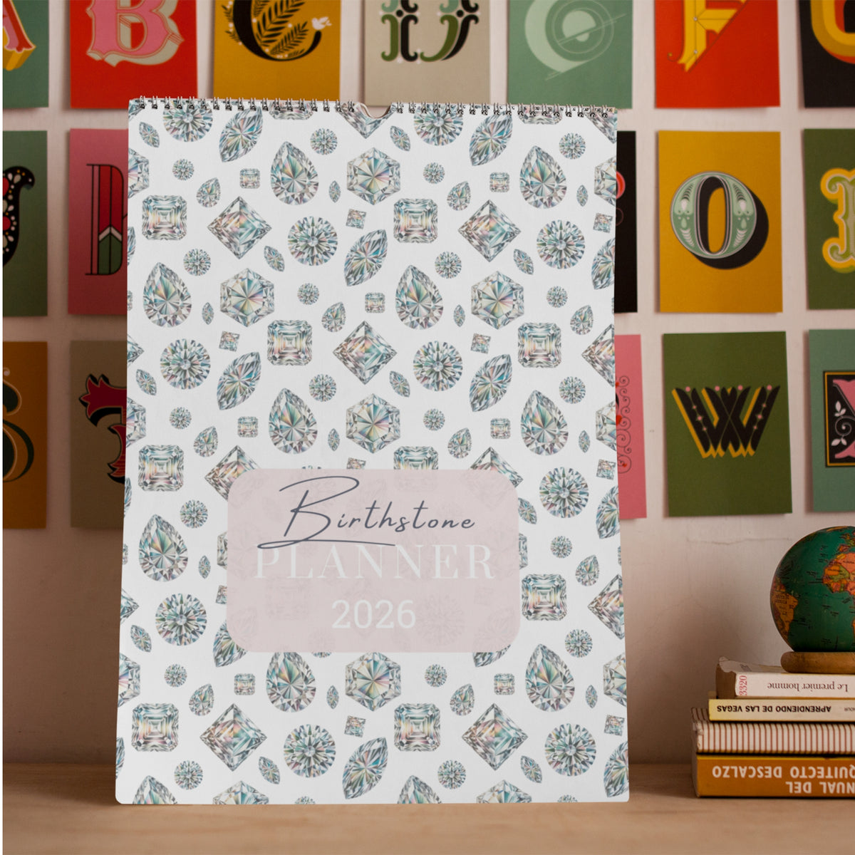 2026 planner with gemstone pattern on a wooden surface with colorful letter blocks in the background