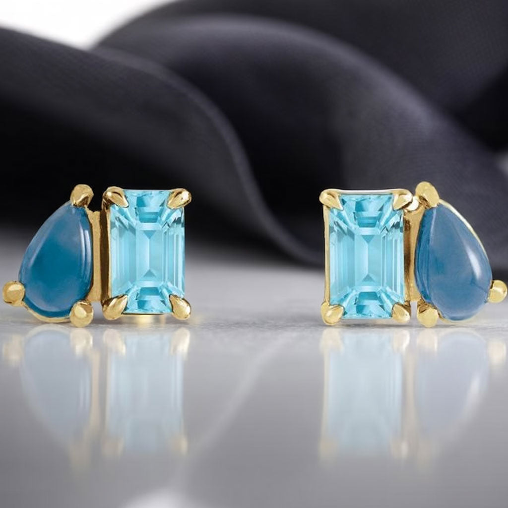 Sky Blue Topaz & Natural London Blue Topaz Two-Stone Stud Earrings on gray background