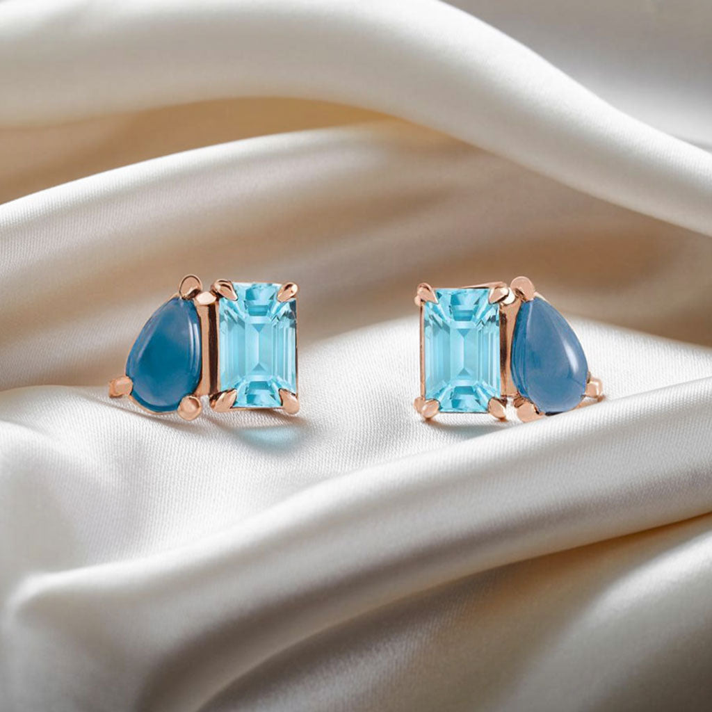 Sky Blue Topaz & Natural London Blue Topaz Two-Stone Rose Gold Stud Earrings on white silk
