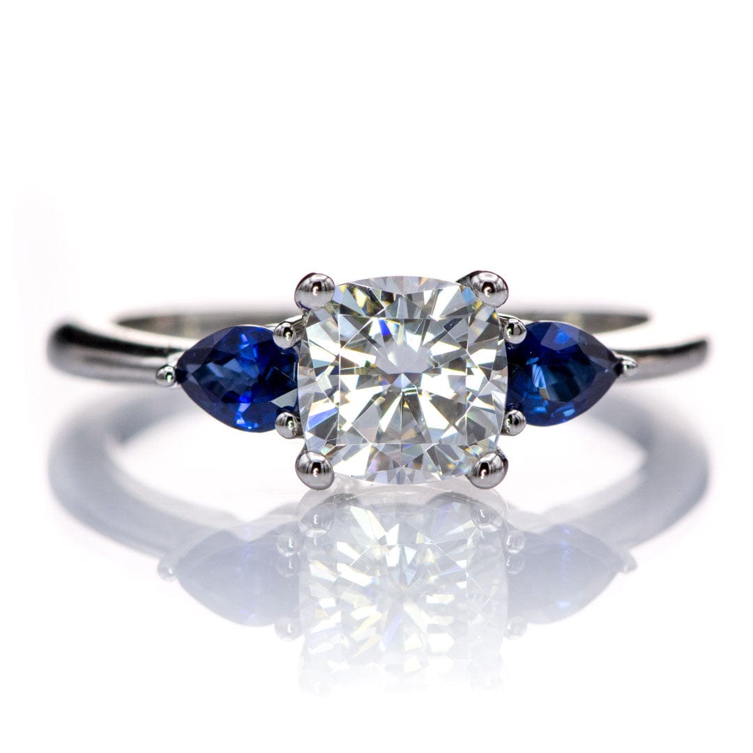 Tressa- Three Stone Engagement Ring, Prong set Cushion Moissanite & Pear Blue Sapphire Accents 6mm Near-Colorless F1 Moissanite (GHI Color) / 14k Nickel White Gold Ring by Nodeform