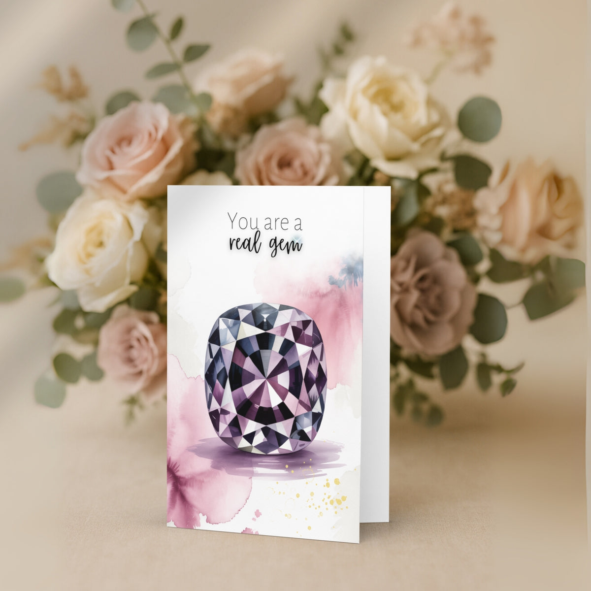 Greeting card with a watercolor spinel illustration and 'You are a real gem' text, surrounded by flowers