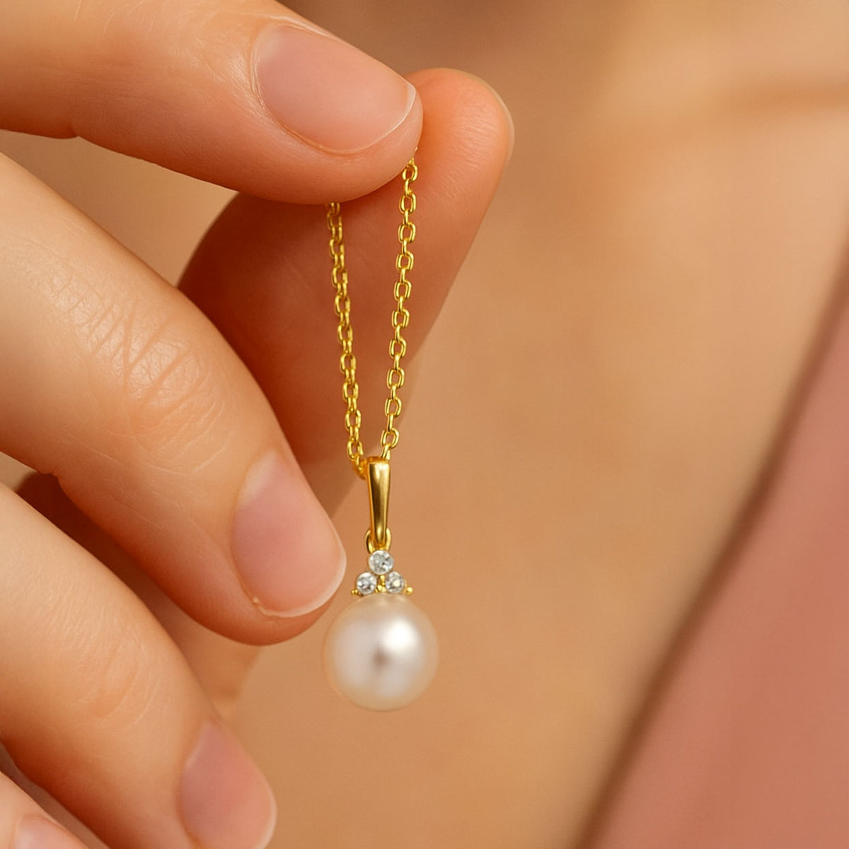 woman holding White Akoya Pearl Diamond Accented 14k Yellow Gold Dangle Pendant Necklace