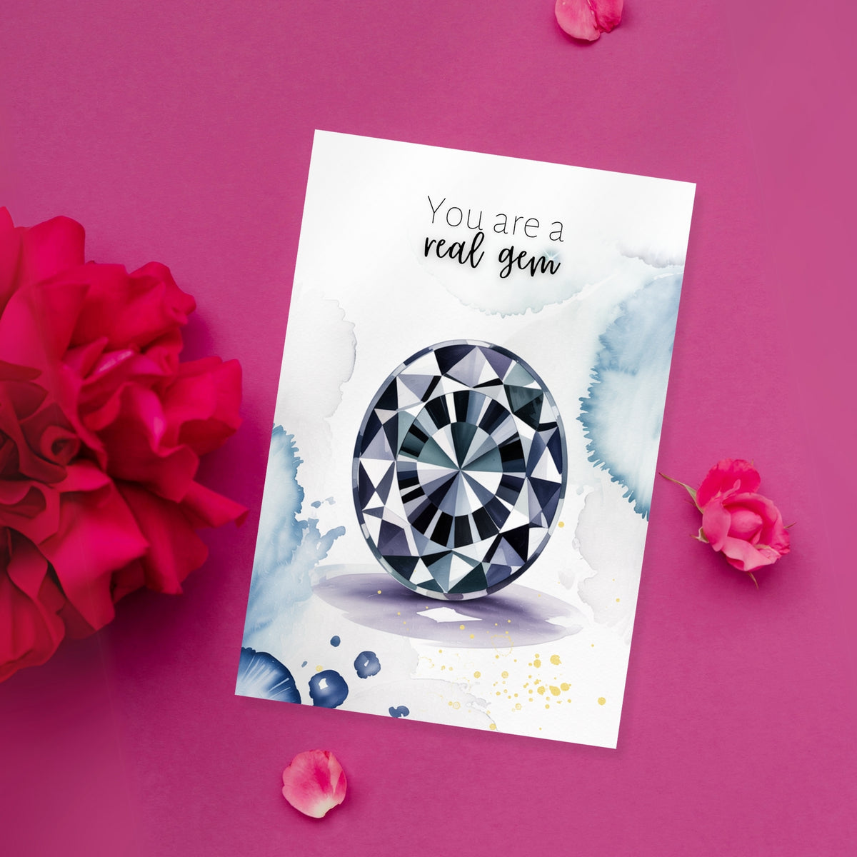 Greeting card with a oval Spinel Gemstone illustration and 'You are a real gem' text on a pink background with flowers.