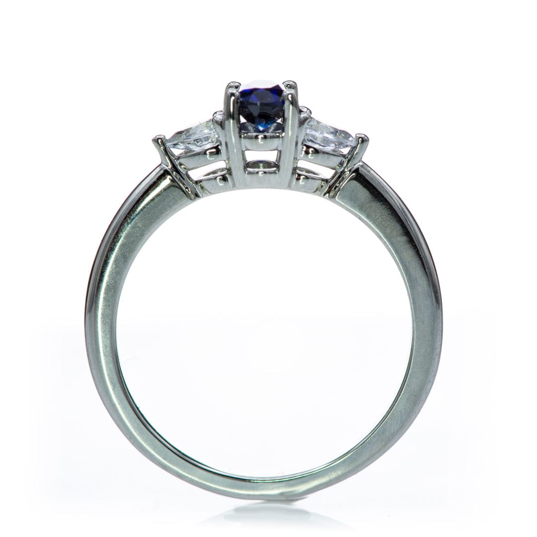 Tressa - Three Stone Prong Set Oval Lab Sapphire Engagement Ring with Pear-shaped White Sapphire Accents Ring by Nodeform