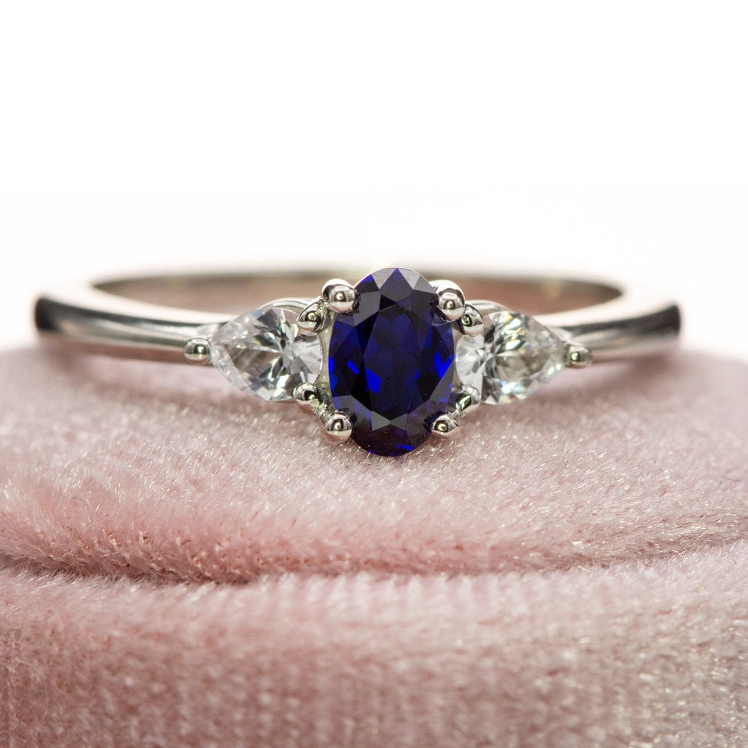 Tressa - Three Stone Prong Set Oval Lab Sapphire Engagement Ring with Pear-shaped White Sapphire Accents Ring by Nodeform