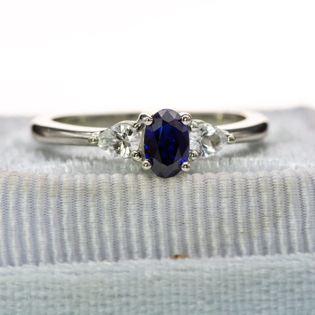 Tressa - Three Stone Prong Set Oval Lab Sapphire Engagement Ring with Pear-shaped White Sapphire Accents Ring by Nodeform