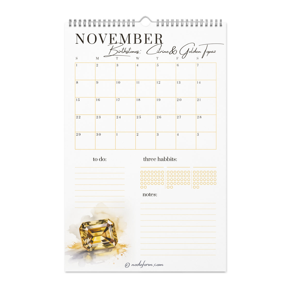 Calendar with November dates and a yellow citrine gemstone on a white background