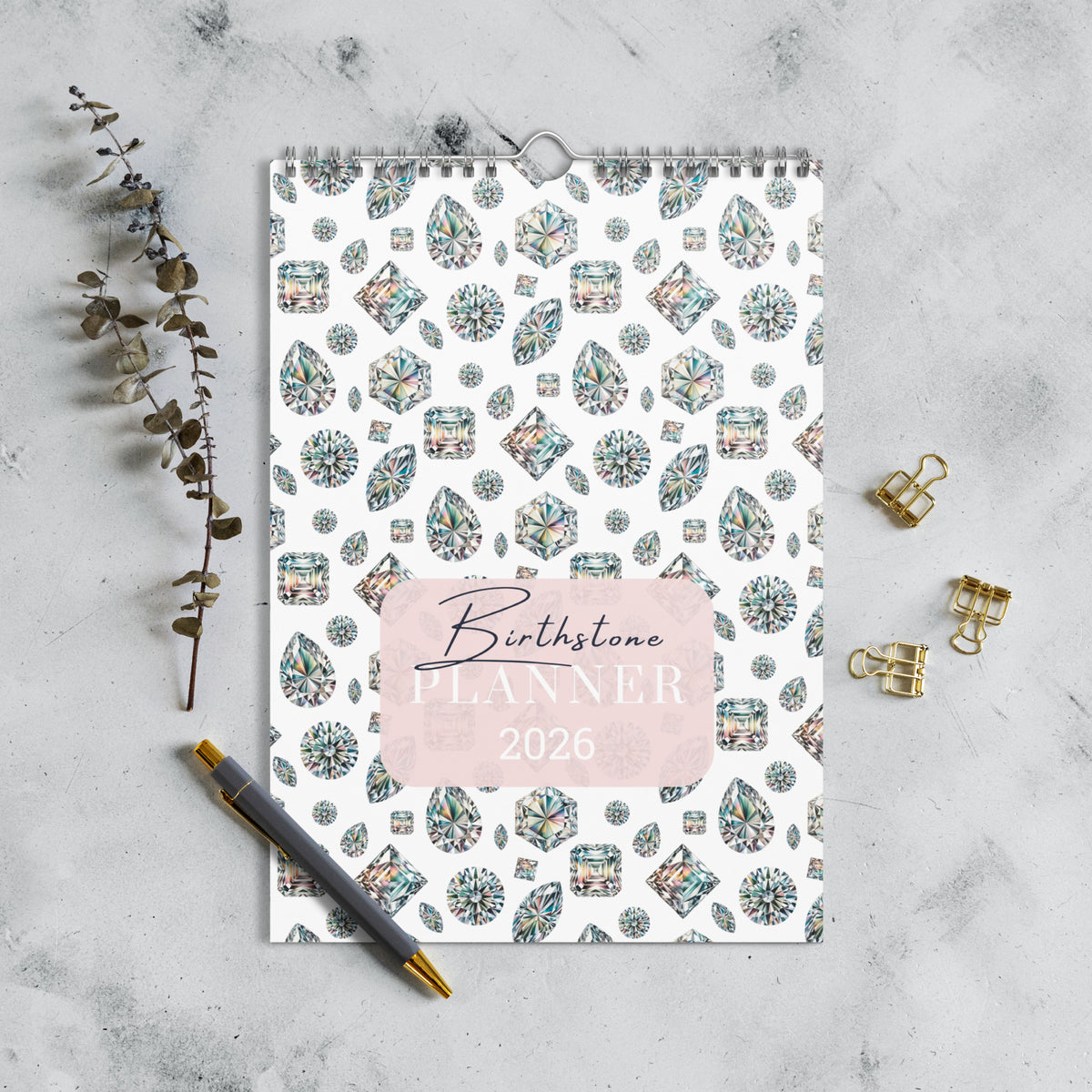 2026 Birthstone Planner with gemstone pattern on a marble surface