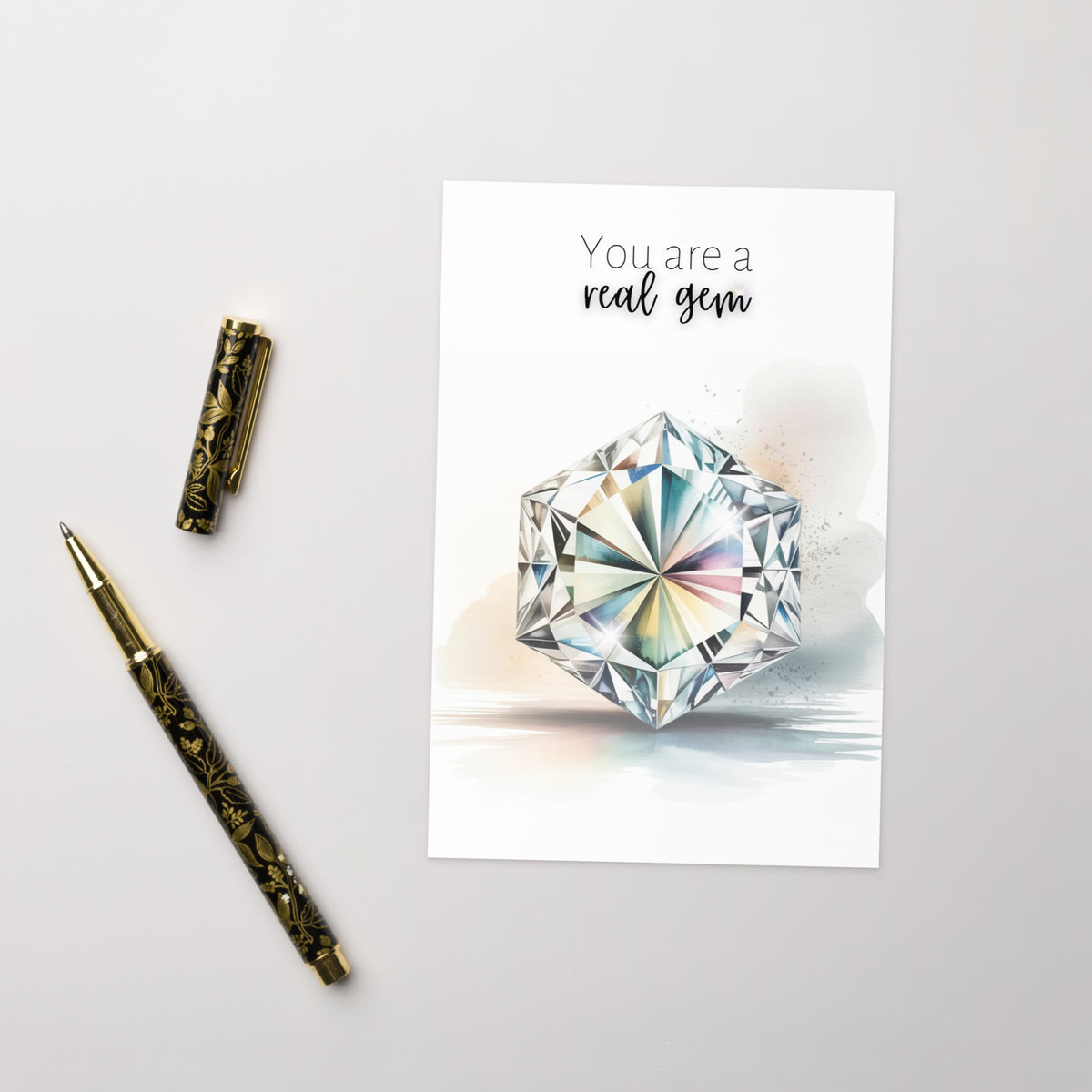 Card with hexagon diamond illustration and text 'You are a real gem' on a white background with decorative pen.