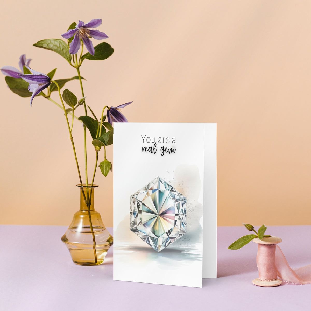 Greeting card with a hexagon diamond illustration and flowers on a pastel background