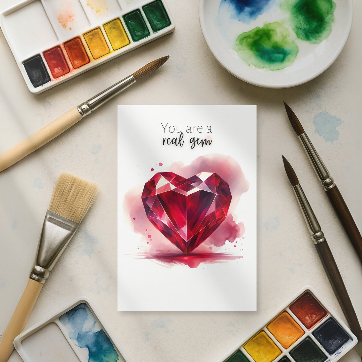 You are a real gem Watercolor Ruby Heart Folded Anniversary or July Birthday Card on artist table