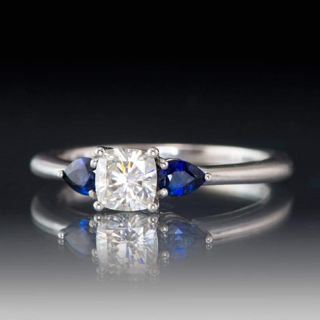Tressa- Three Stone Engagement Ring, Prong set Cushion Moissanite & Pear Blue Sapphire Accents Ring by Nodeform