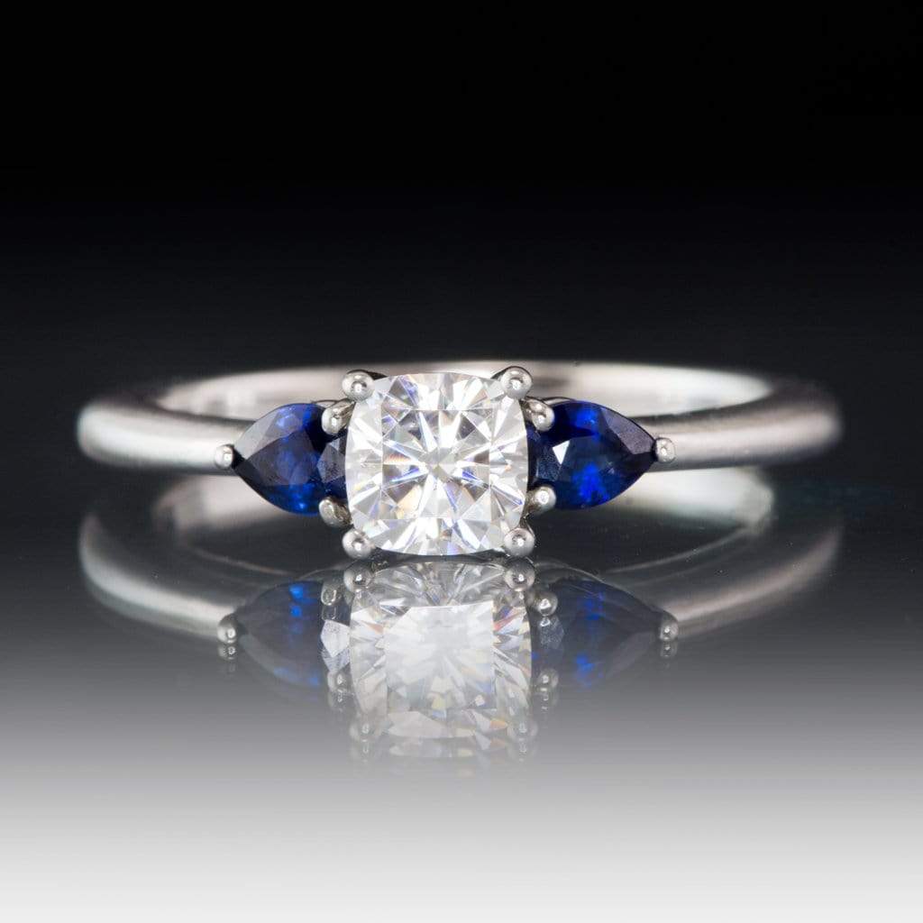 Tressa- Three Stone Engagement Ring, Prong set Cushion Moissanite & Pear Blue Sapphire Accents 5mm Colorless F1 Moissanite (DEF Color) / Platinum Ring by Nodeform