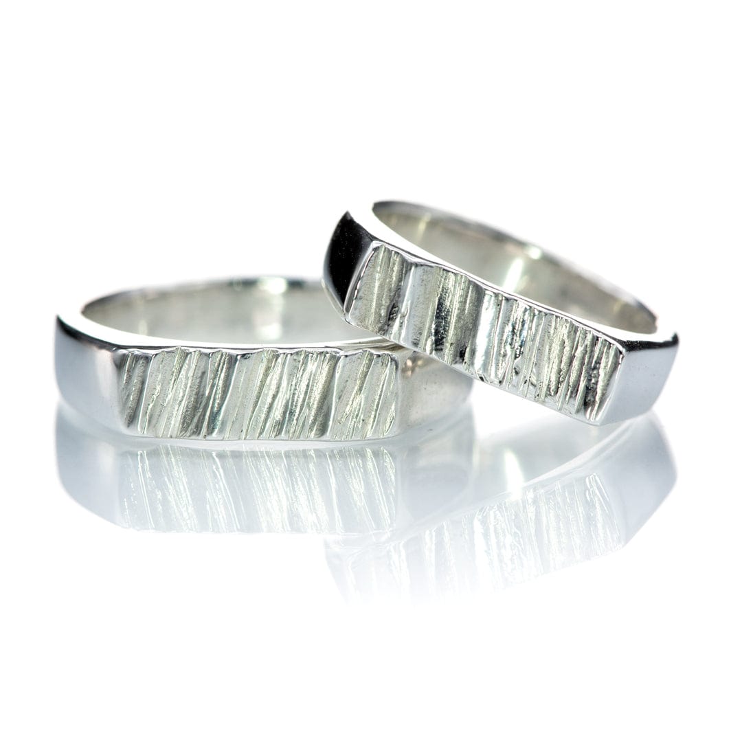 http://nodeform.com/cdn/shop/products/matching-saw-cut-wedding-rings-4.5mm-sterling-silver-DSC_5535.jpg?v=1674688424