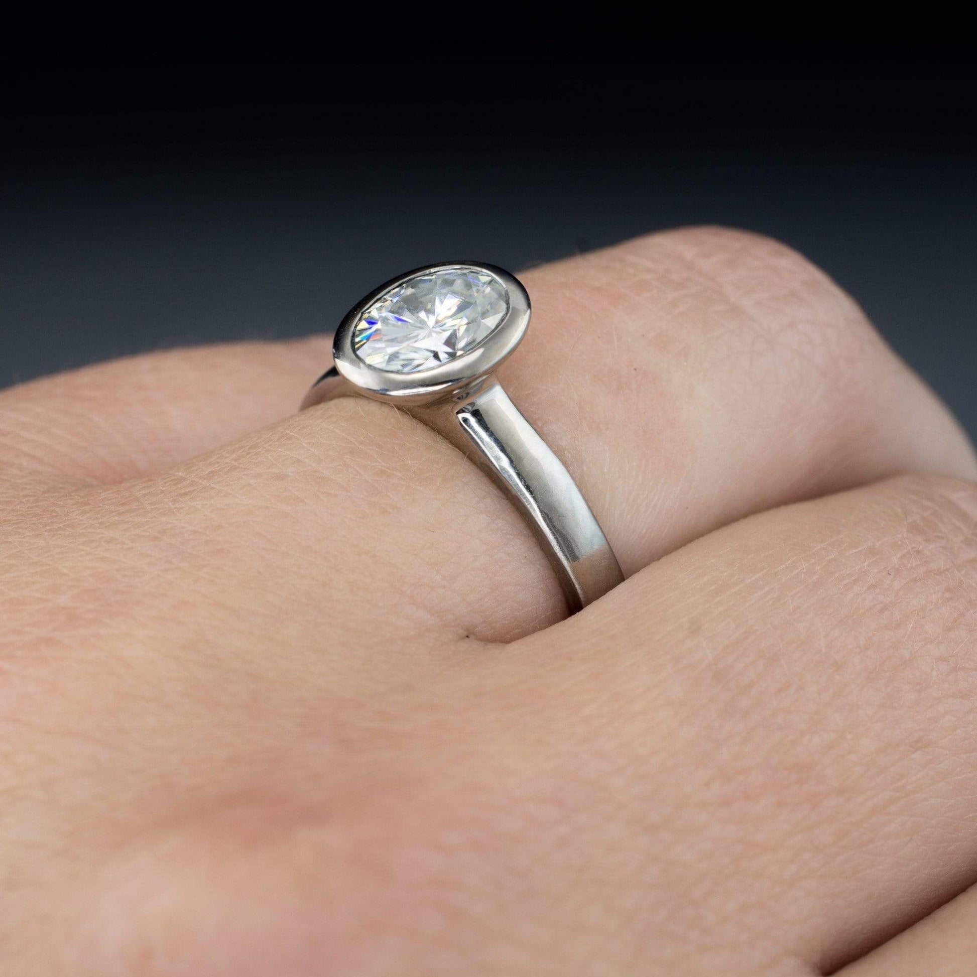 Oval Moissanite Peekaboo Bezel Solitaire Engagement Ring Ring by Nodeform