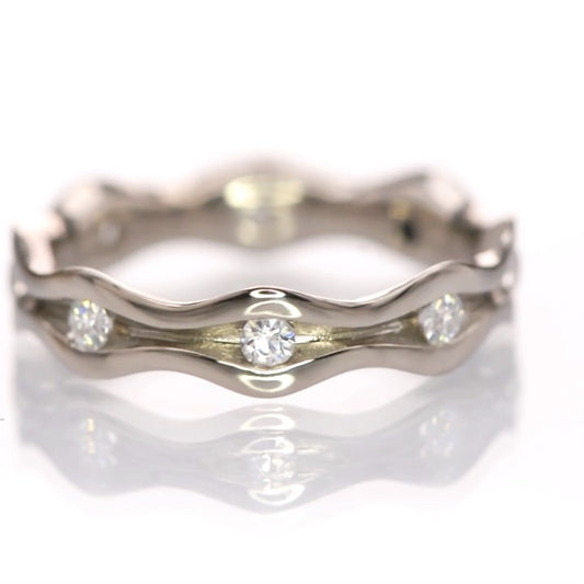 An eternity ring with Moissanites...