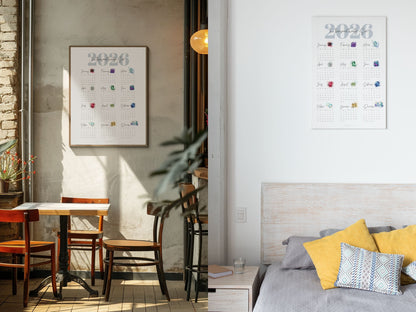 Modern interior with a dining area and a wall above the bed with a 2026 birthstone  calendar.