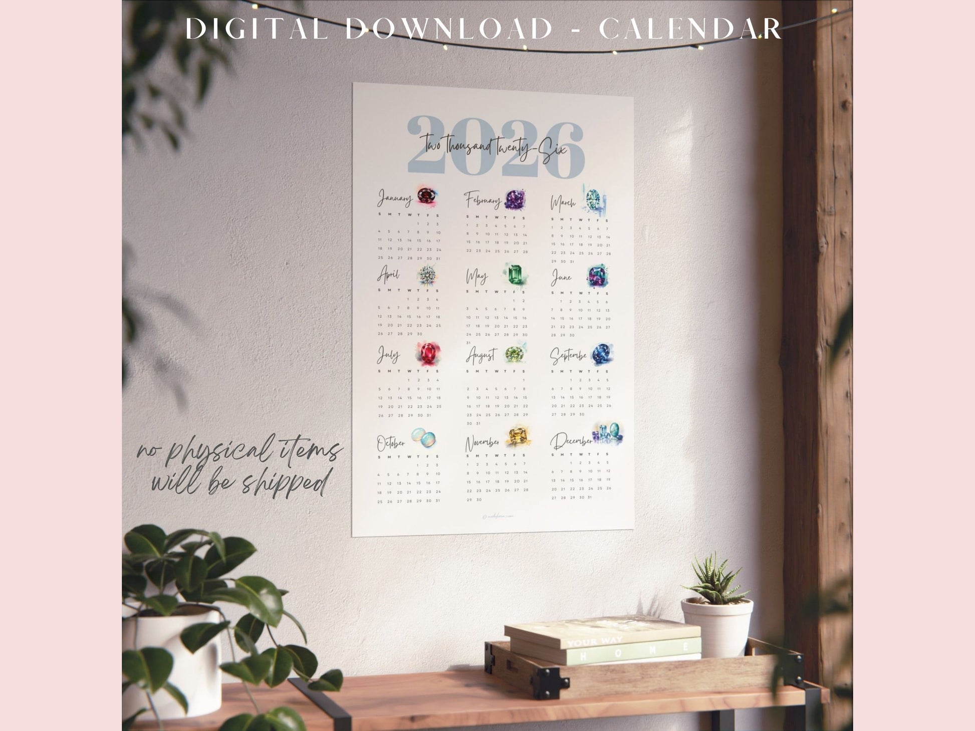 2026 birthstone calendar digital download displayed on a wall with a desk and plants in the foreground.