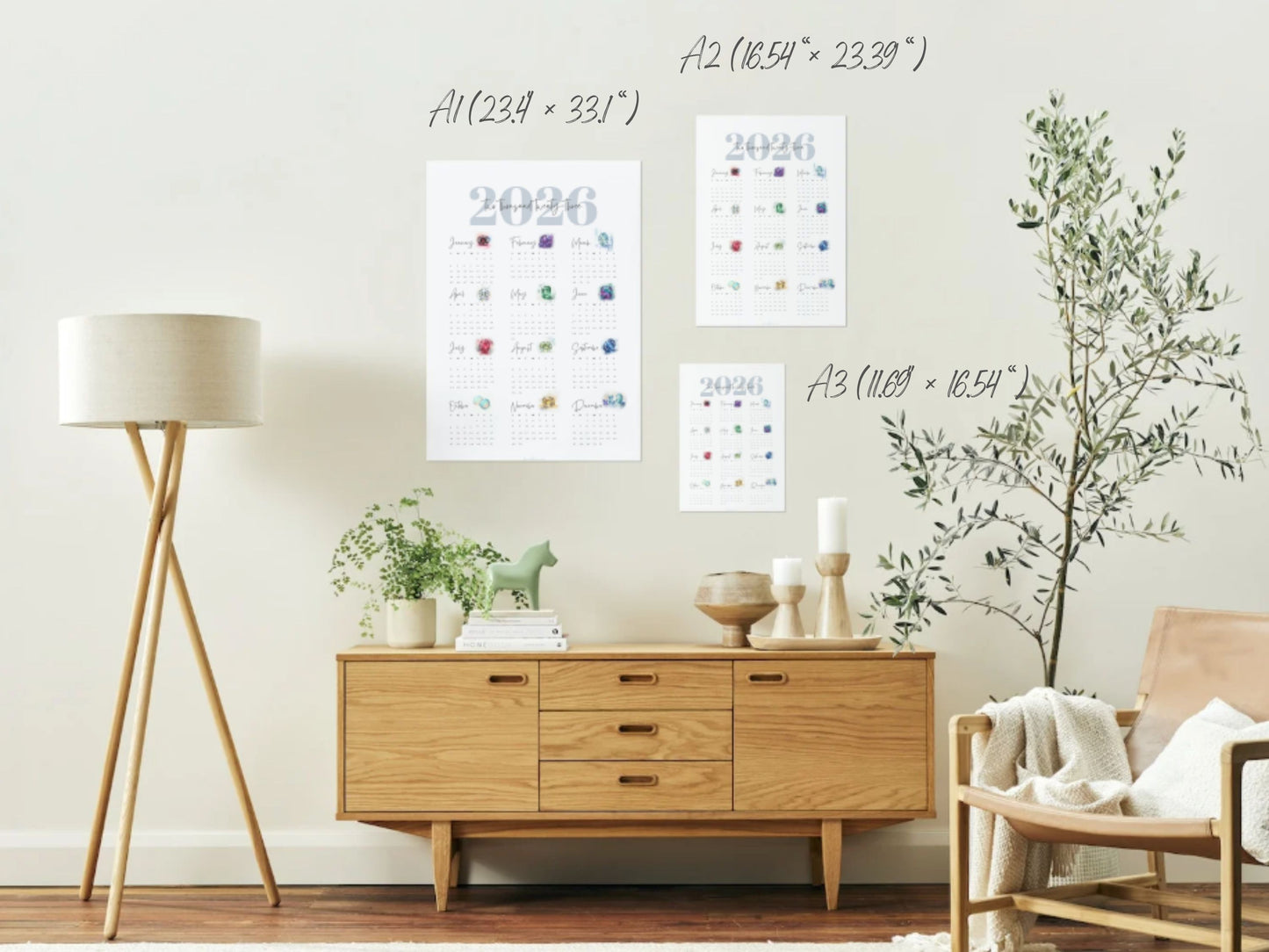 Modern living room with wooden cabinet, lamp, and decorative items and wall hung birthstone calendars in 3 sizes.