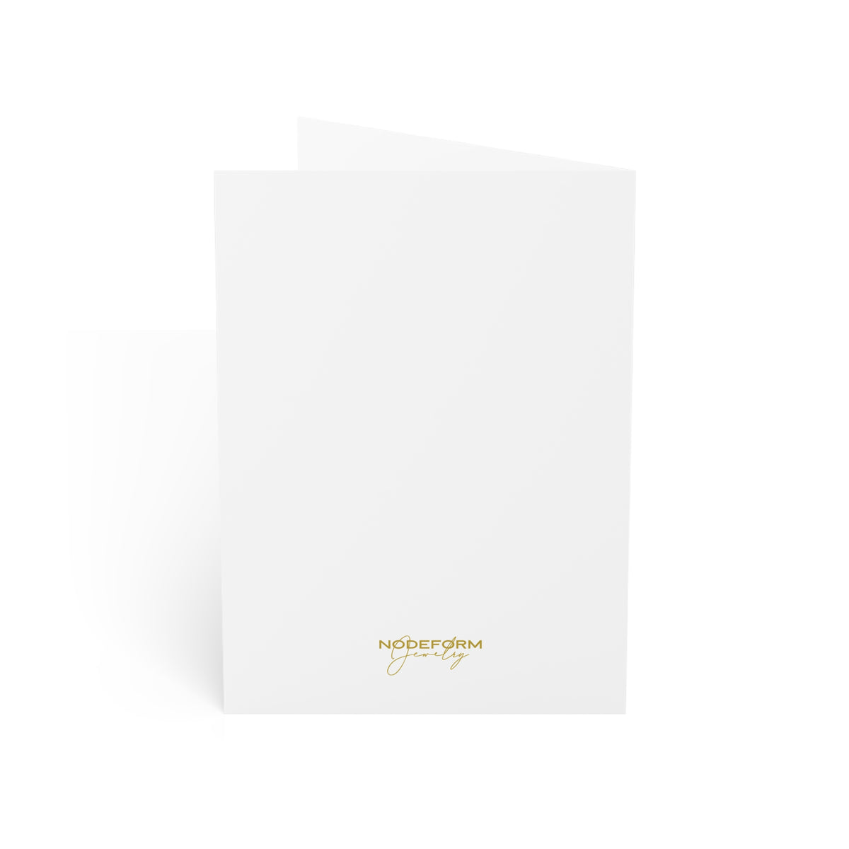 Backside of folded greeting card with gold text on a white background