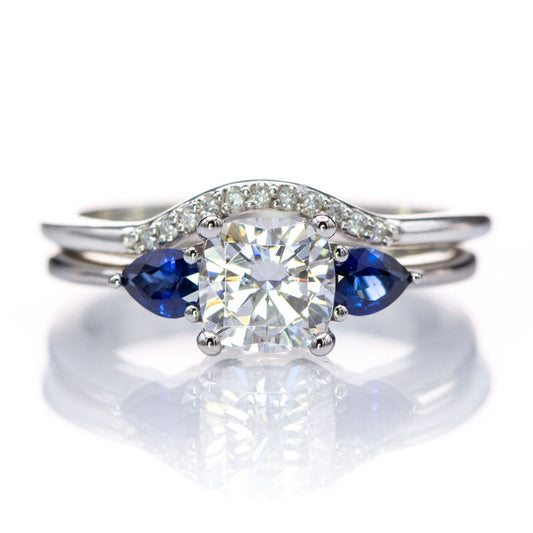 Tressa- Three Stone Engagement Ring, Prong set Cushion Moissanite & Pear Blue Sapphire Accents Ring by Nodeform