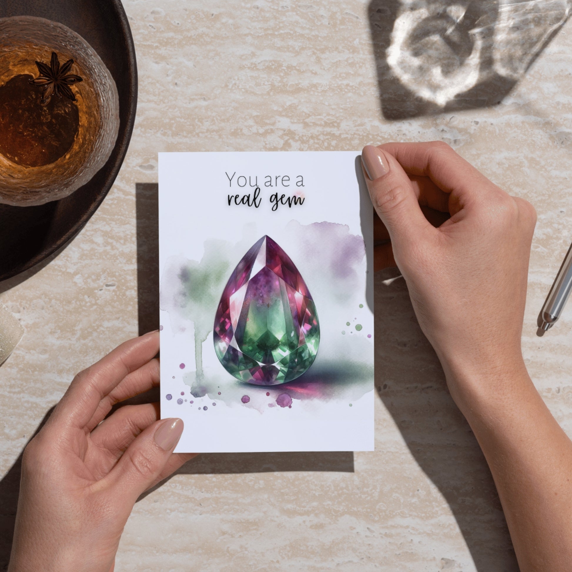 hands holding a "You are a real Gem" Watercolor Pear Bi-color Tourmaline Folded Card Cards by Nodeform
