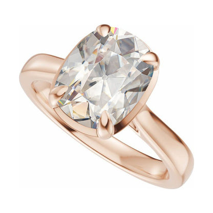 Taylor engagement ring  in rose gold with a large elongated antique cut cushion moissanite on a white reflective background