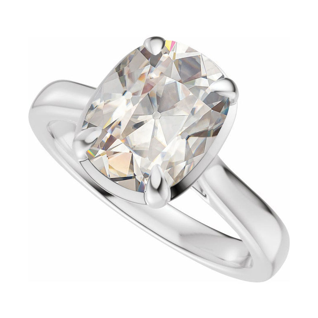 Taylor engagement ring  in white gold with a large elongated antique cut cushion moissanite on a white reflective background