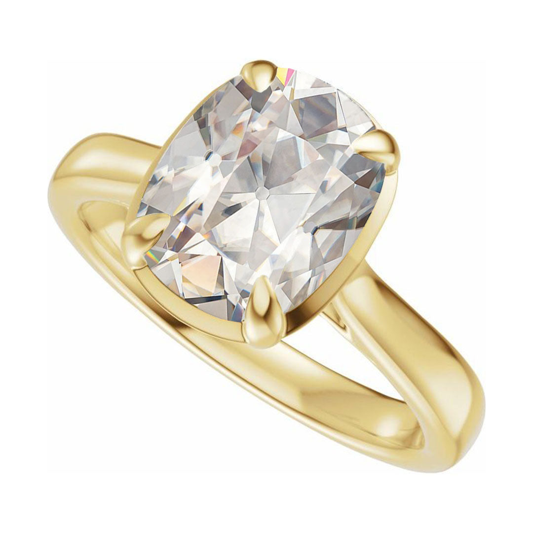 Taylor engagement ring  in yellow gold with a large elongated antique cut cushion moissanite on a white reflective background