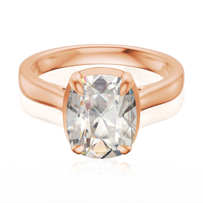 Taylor engagement ring  in rose gold with a large elongated antique cut cushion moissanite on a white reflective background