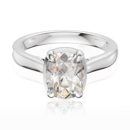 Taylor engagement ring  in white gold with a large elongated antique cut cushion moissanite on a white reflective background
