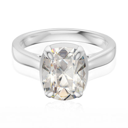 Taylor engagement ring  in white gold with a large elongated antique cut cushion moissanite on a white reflective background