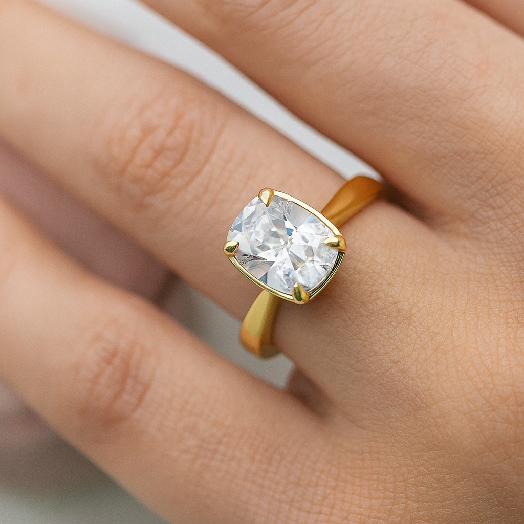 Taylor engagement ring  in rose gold with a large elongated antique cut cushion moissanite on a woman's hand