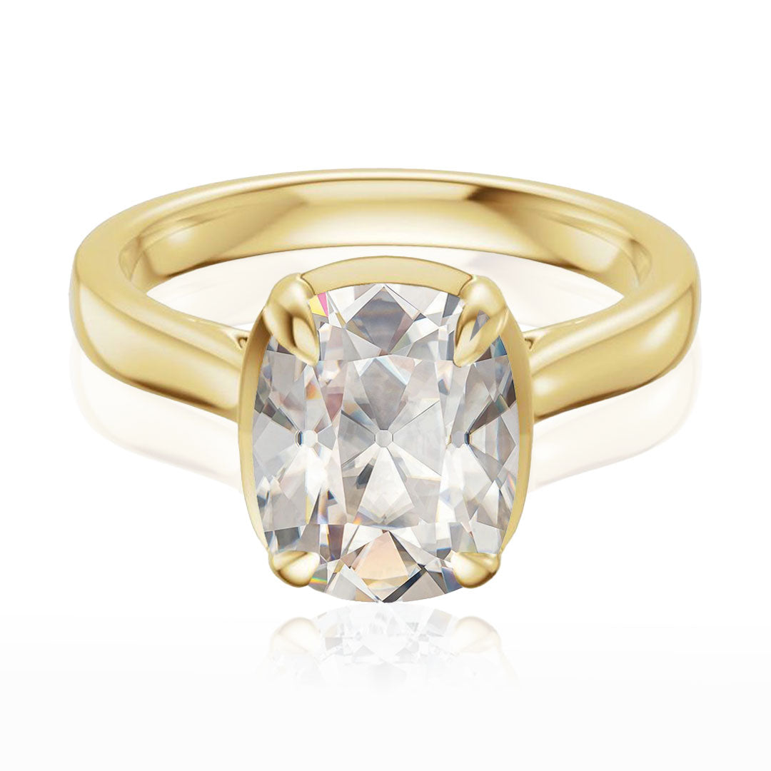 Taylor engagement ring  in yellow gold with a large elongated antique cut cushion moissanite on a white reflective background