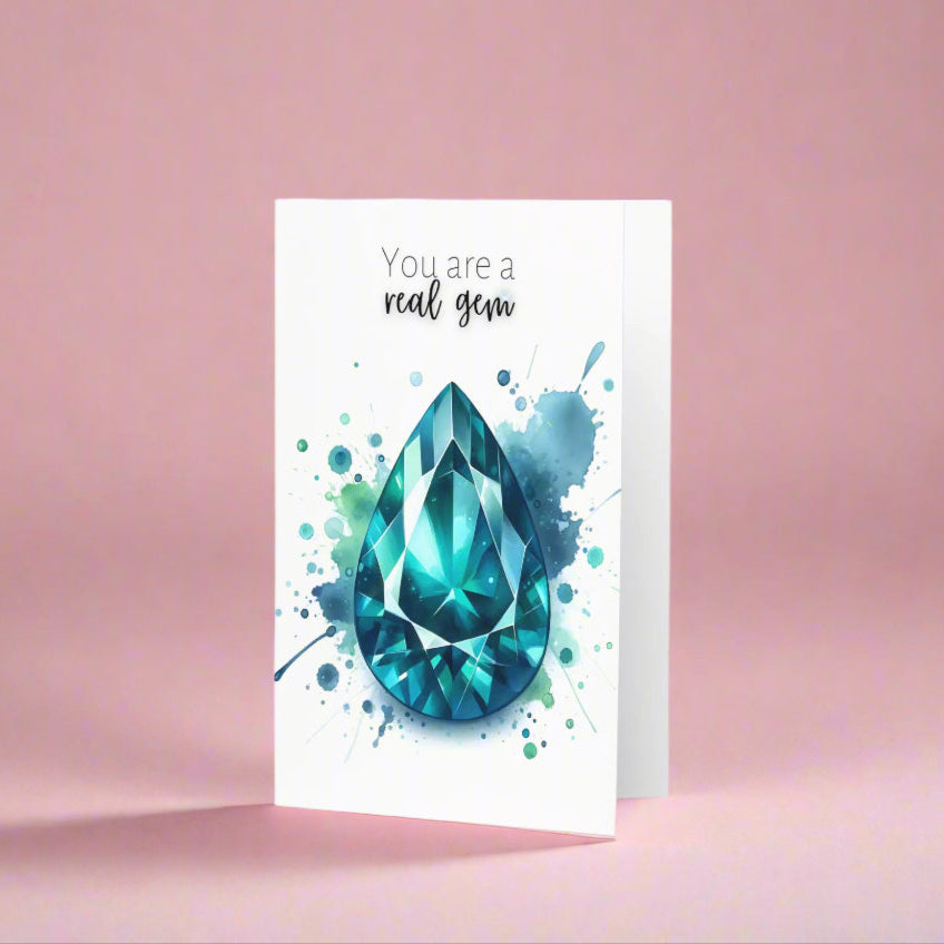 Watercolor Pear Teal Sapphire You are a Real Gem Folded Greeting Card on pink backdrop