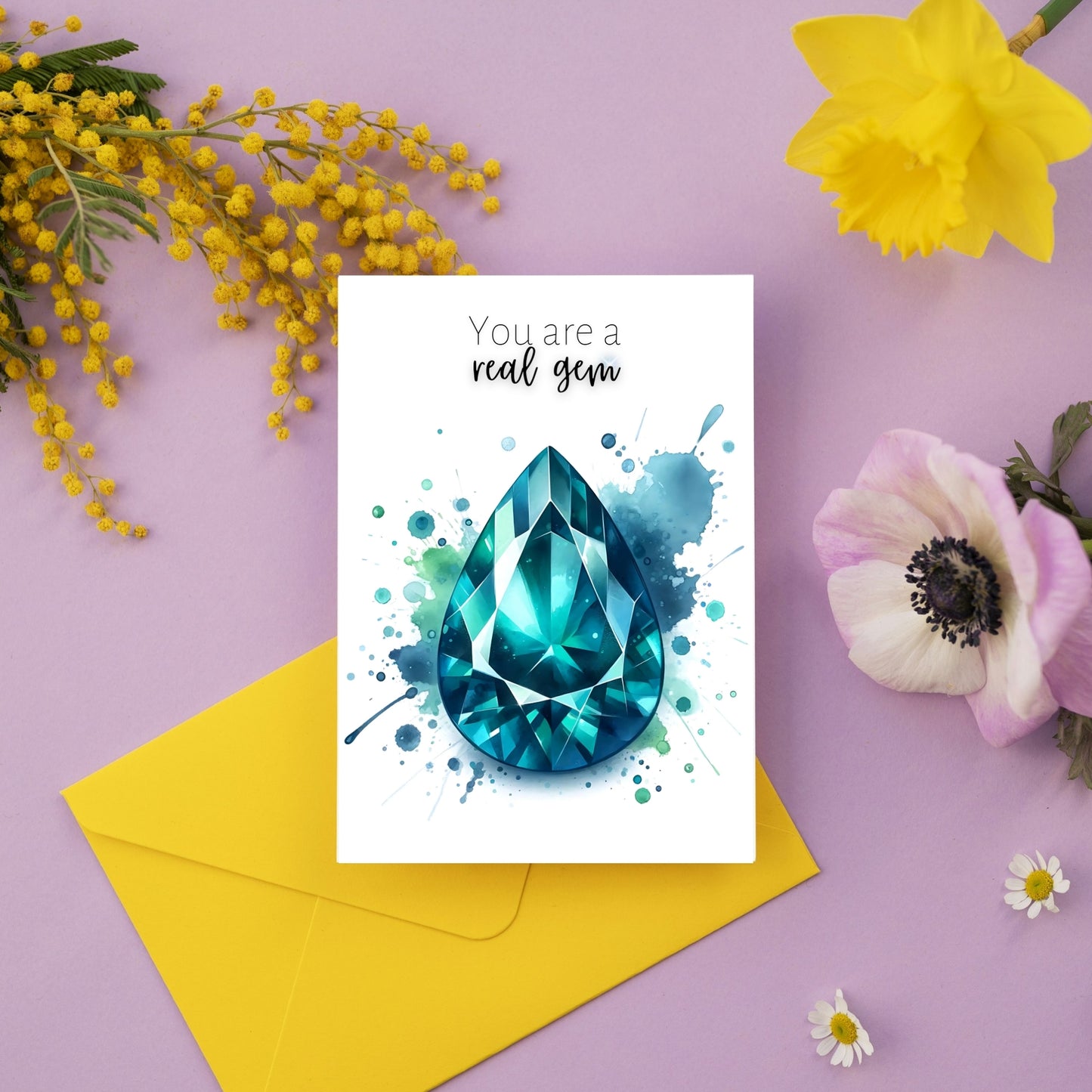 Watercolor Pear Teal Sapphire You are a Real Gem Greeting Card next to flowers