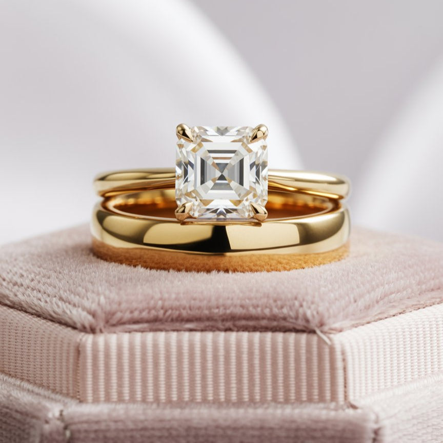 Julia ring with Prong Set asscher cut diamond in a Narrow Cathedral Solitaire Engagement Ring with matching gold wedding band