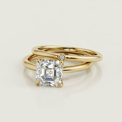 Julia ring with Prong Set asscher cut diamond in a Narrow Cathedral Solitaire Engagement Ring with single diamond gold wedding band