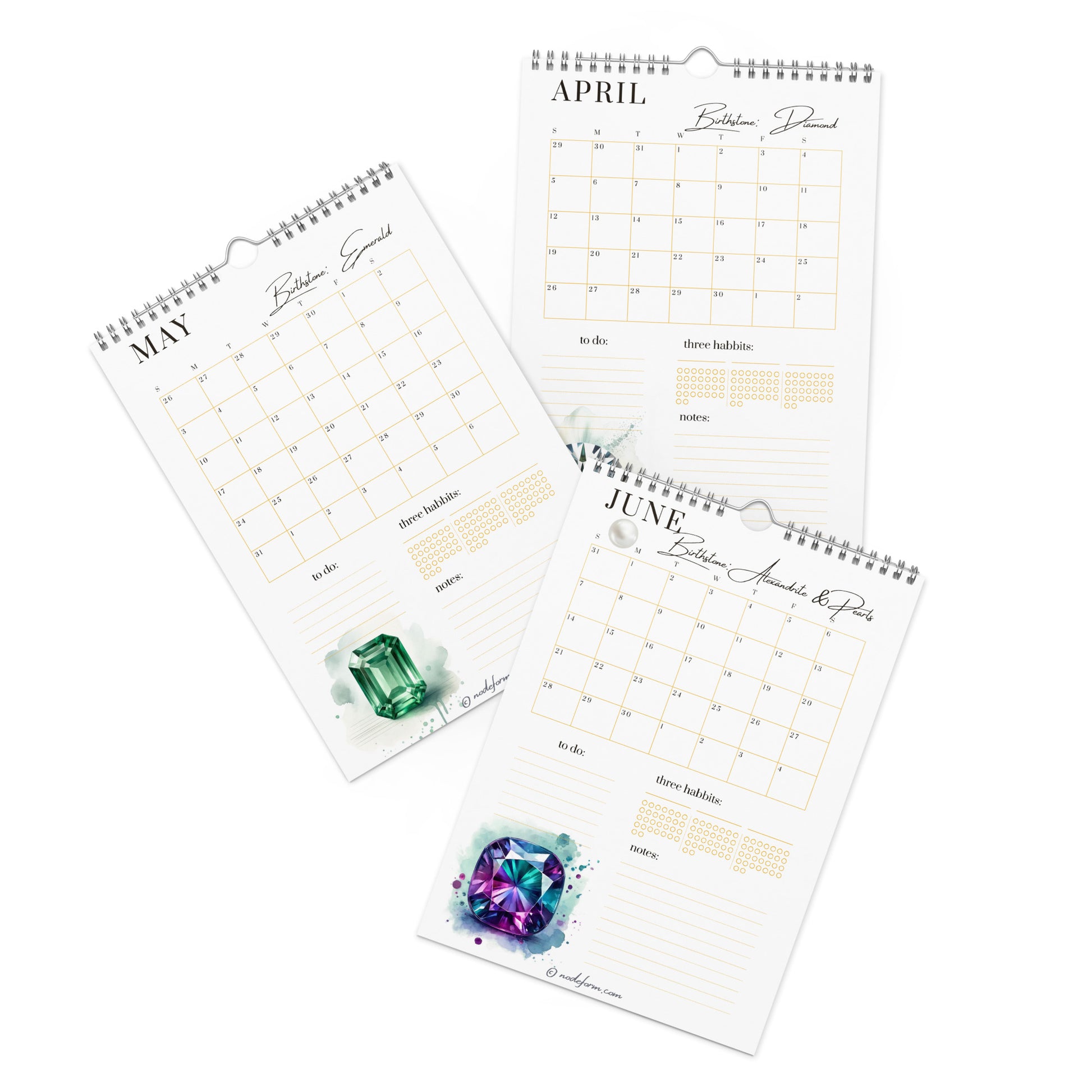 Three spiral-bound calendars for April, May, and June with gemstone illustrations on a white background.