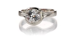 Lab Created Round White Sapphire Fold Solitaire Engagement Ring