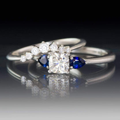 Tressa- Three Stone Engagement Ring, Prong set Cushion Moissanite & Pear Blue Sapphire Accents Ring by Nodeform