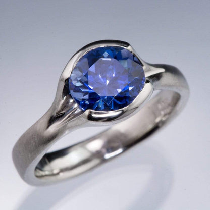 Lab Created Round Blue Sapphire Fold Solitaire Engagement Ring Ring by Nodeform
