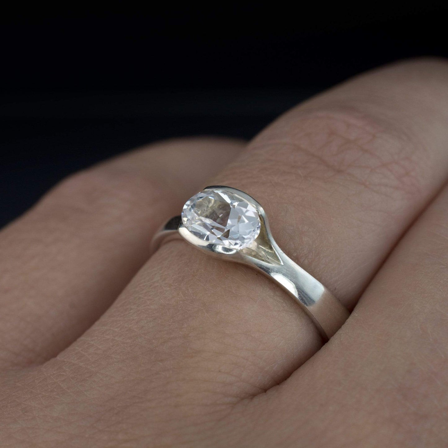 Oval White Sapphire Half Bezel Fold Solitaire Engagement Ring Ring by Nodeform