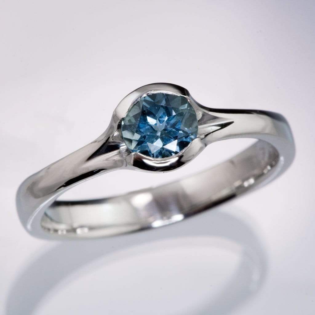 Fair Trade Teal / Blue Montana Sapphire Fold Solitaire Engagement Ring Larger 5.25mm/0.65-0.7ct Teal Blue/Green Sapphire: K / 14kPD White Gold Ring by Nodeform
