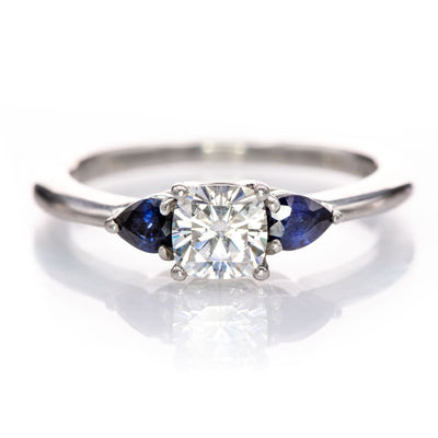 Tressa- Three Stone Engagement Ring, Prong set Cushion Moissanite & Pear Blue Sapphire Accents 5mm Colorless F1 Moissanite (DEF Color) / 14k Nickel White Gold Ring by Nodeform