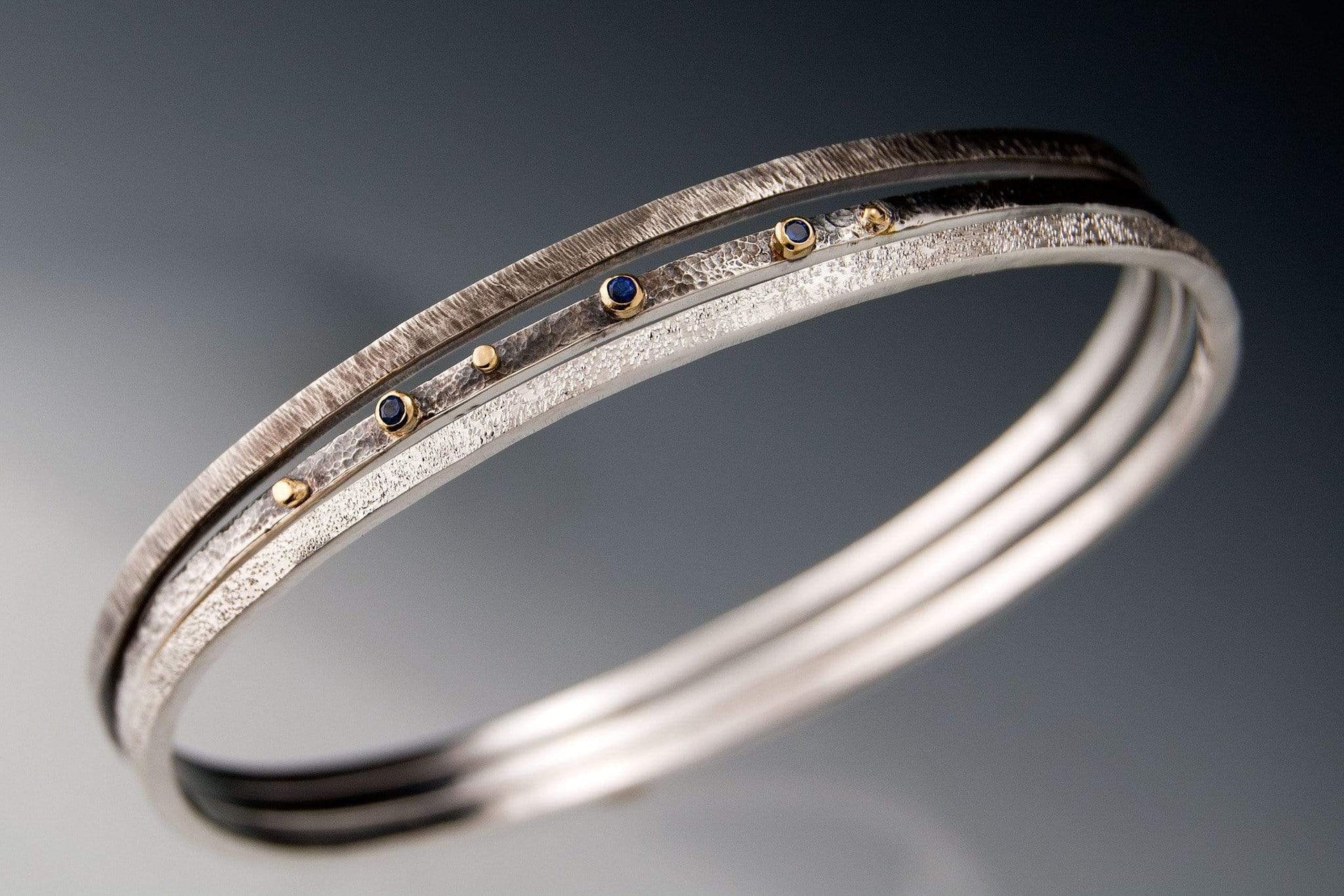 Textured Silver Bracelet Set with Blue Sapphires and 18k Gold Accents Bracelet by Nodeform