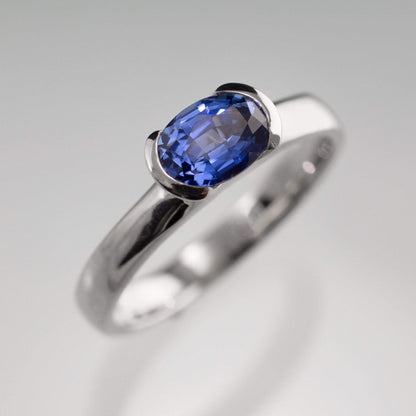 Chatham Lab Created Oval Blue Sapphire Half Bezel Solitaire Engagement Ring Ring by Nodeform