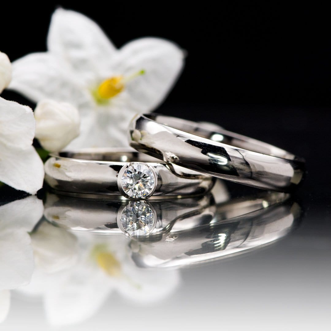 couple of luxury wedding diamond rings for bride and groom isolated on  black background with shadow reflection and copy space. couple ring for  wedding Stock Photo - Alamy