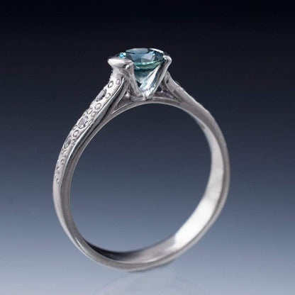 Fair Trade Blue / Teal Montana Sapphire Half Bezel Diamond Star Dust Engagement Ring Ring by Nodeform